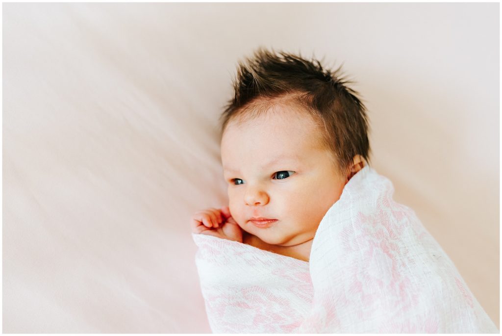 Baby with eyes open Newborn in home lifestyle session