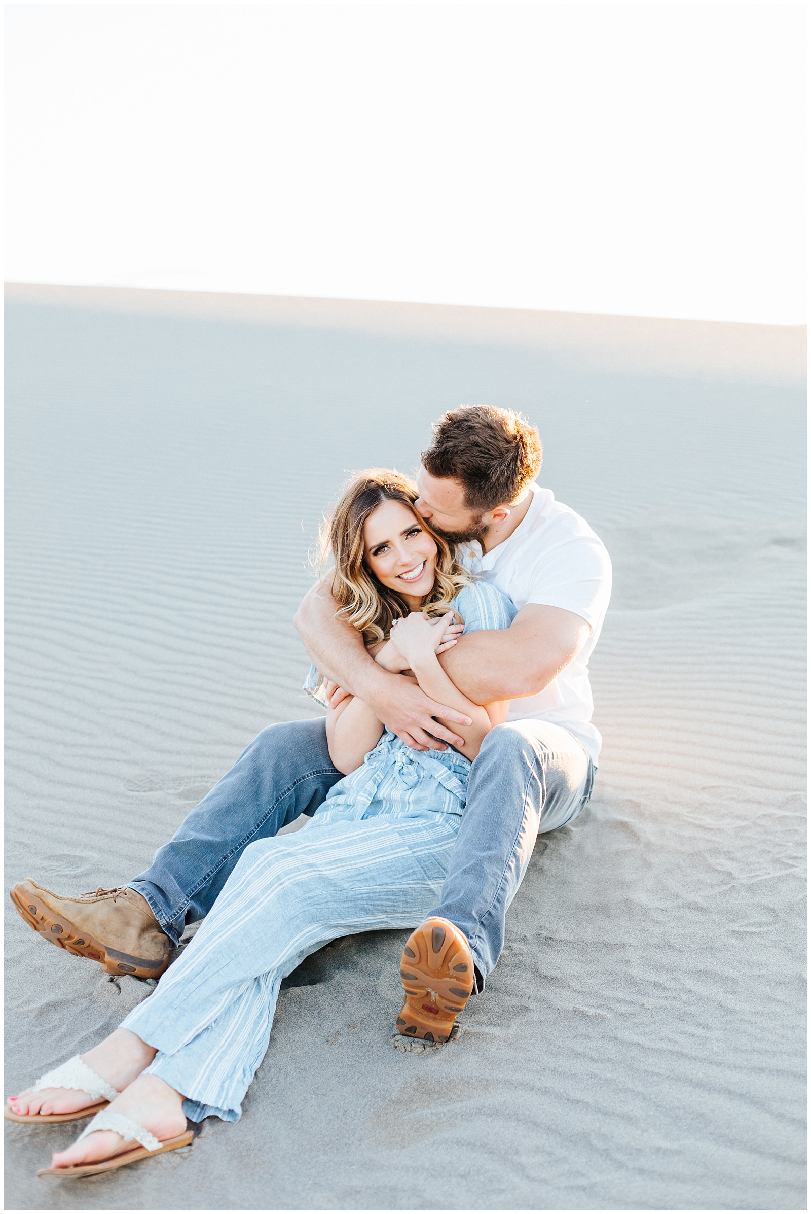 Beachy Romantic Light and Airy Sand Dunes Engagement Session in Blue Linen and White