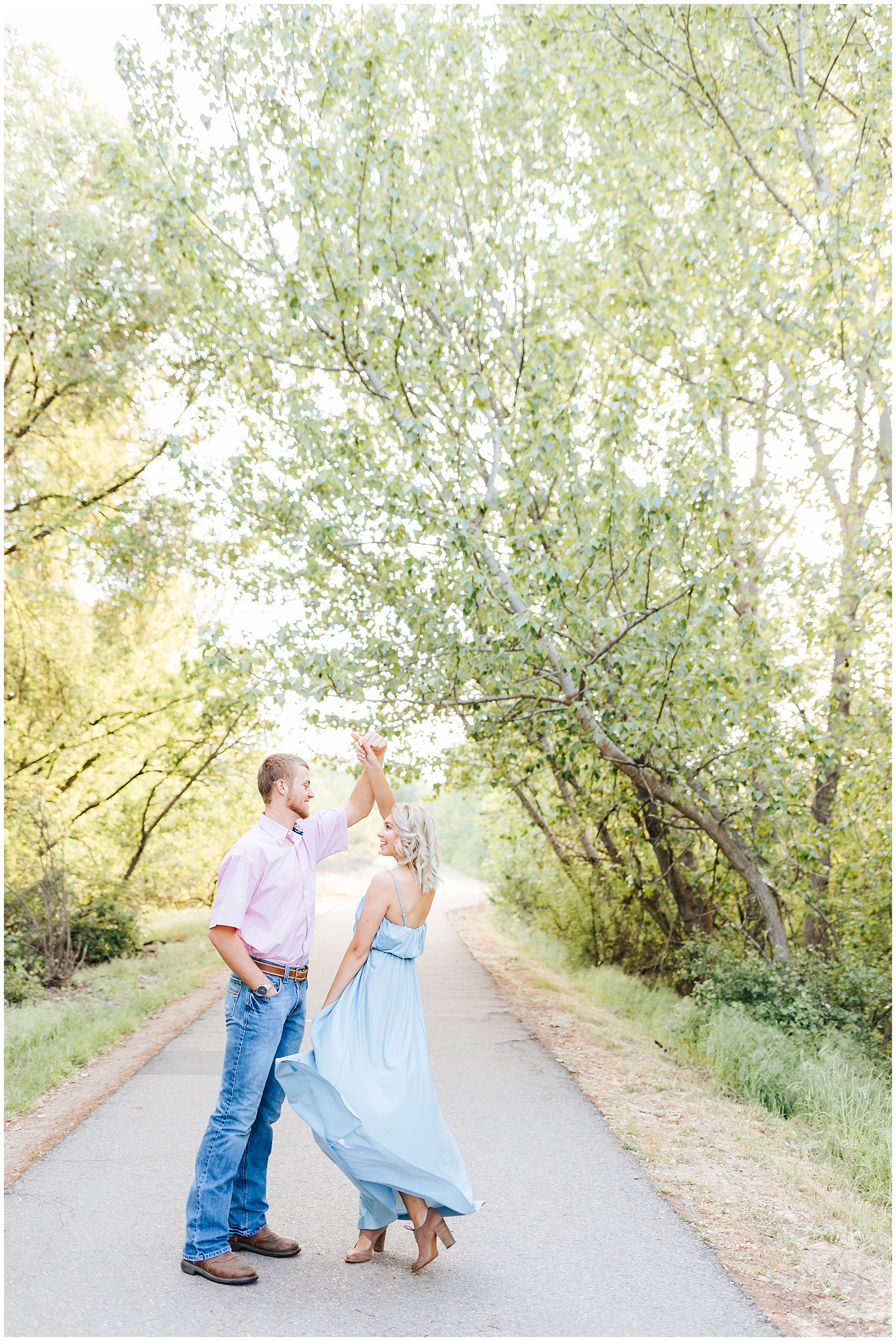 Boise River Spring Engagement Twirling in Dusty Blue Dress