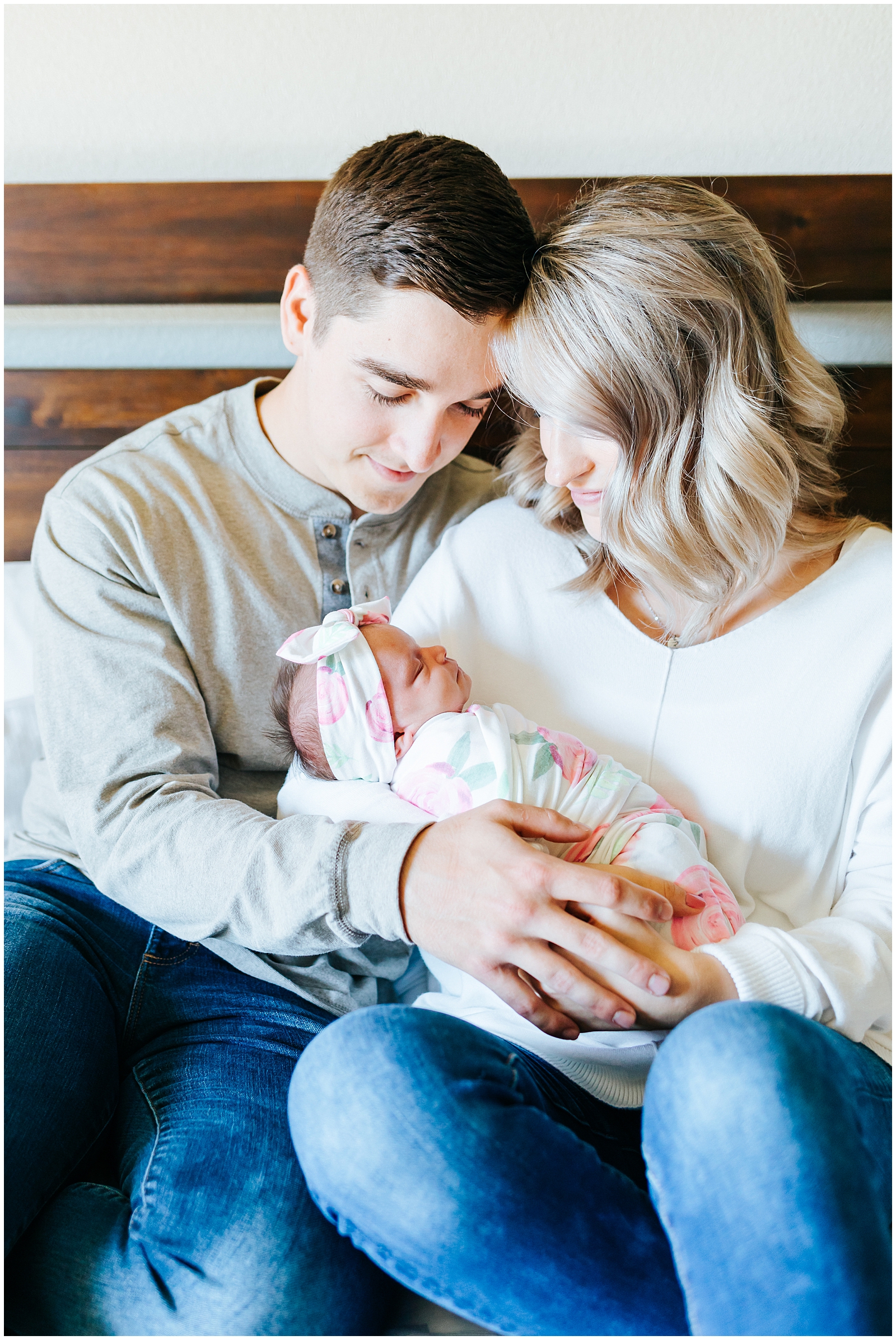 Mom and Dad with newborn baby at lifestyle in home session