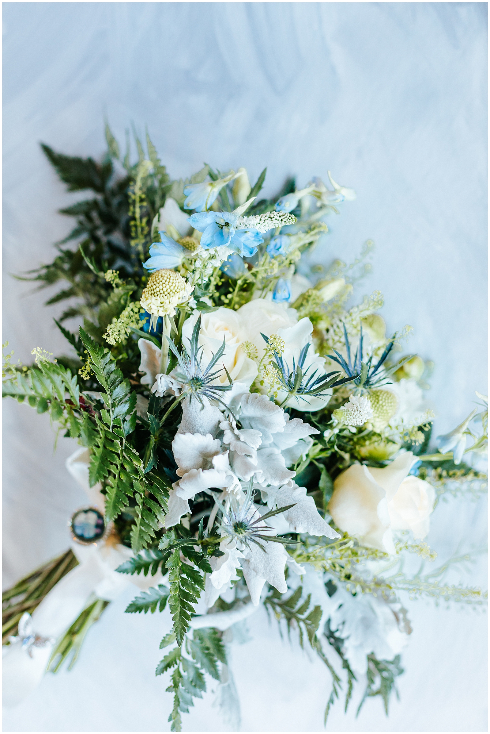 Intimate Still Water Hollow Wedding Dusty Blue and White Bridal Bouquet Flatlay