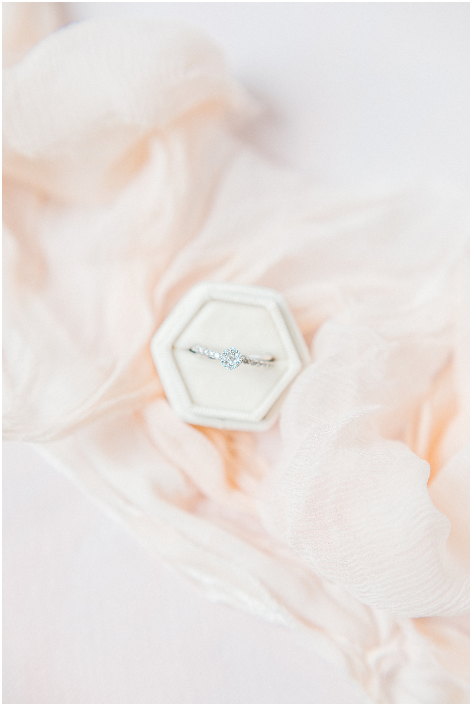 Wedding Ring Detail shot with blush background and linen