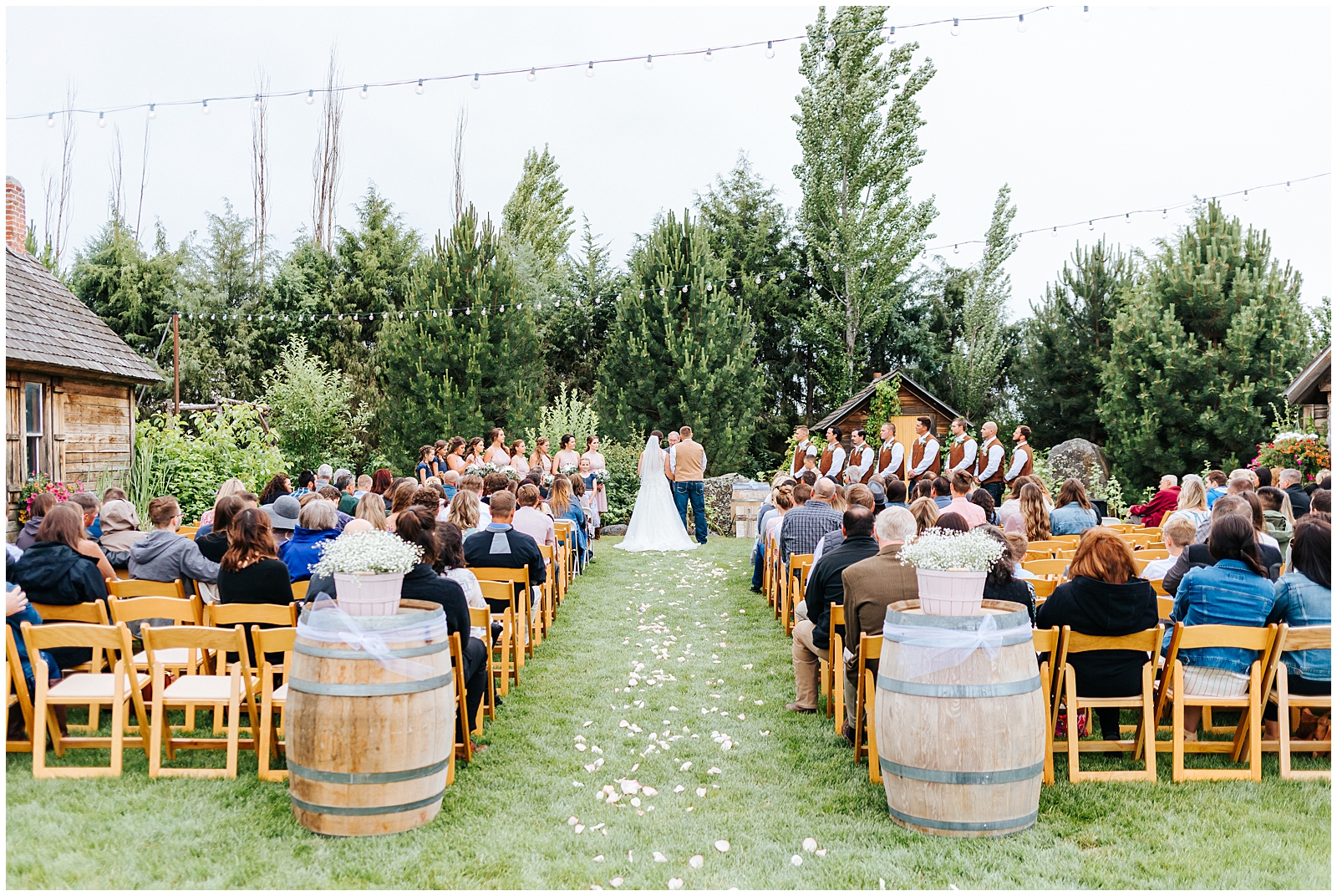 Outdoor Ceremony on the lawn at Rustic Chic Still Water Hollow Wedding