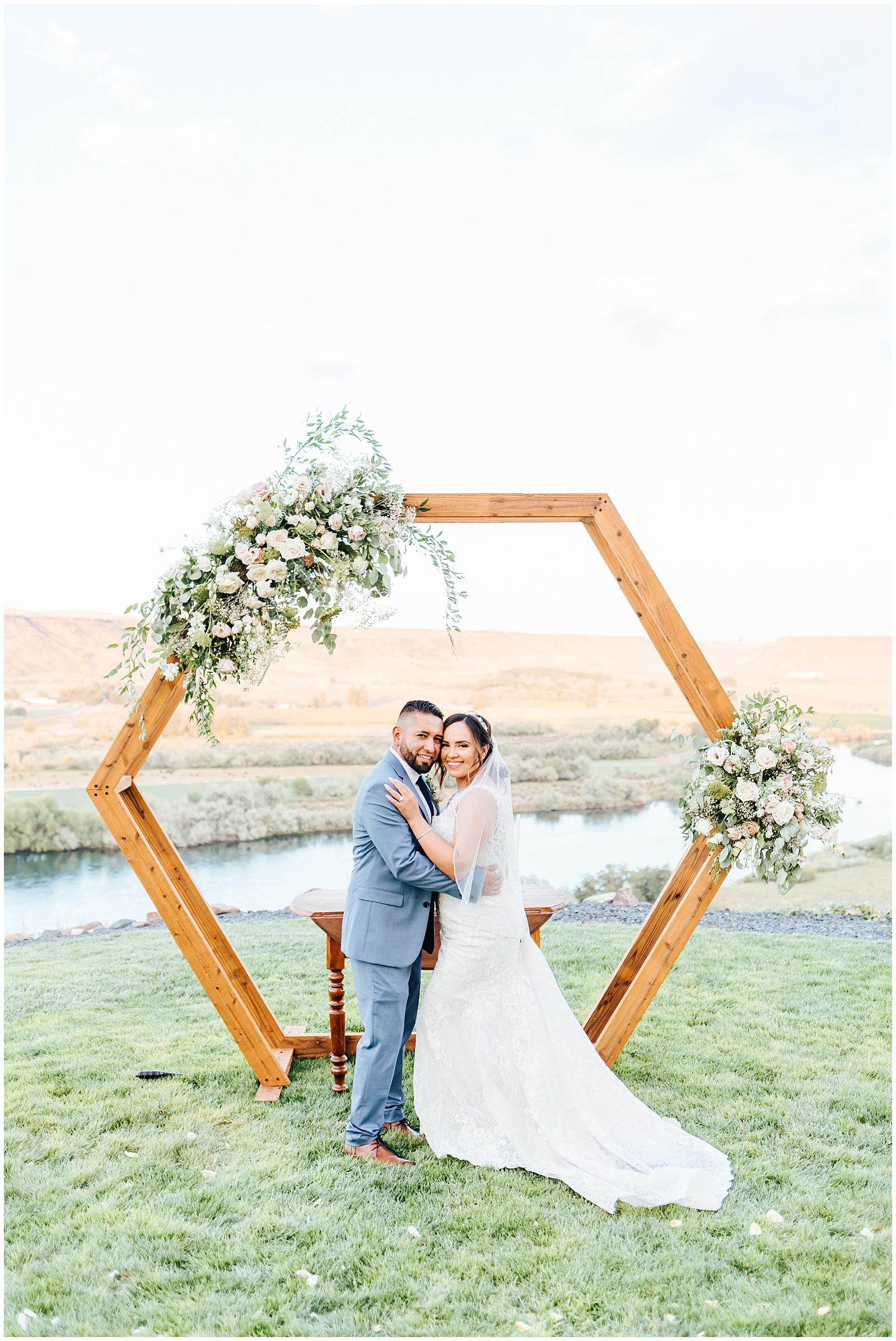 Ceremony Hexagon Wood Arch with Floral Pieces Overlooking the Canyon Portrait of the Bride and Groom