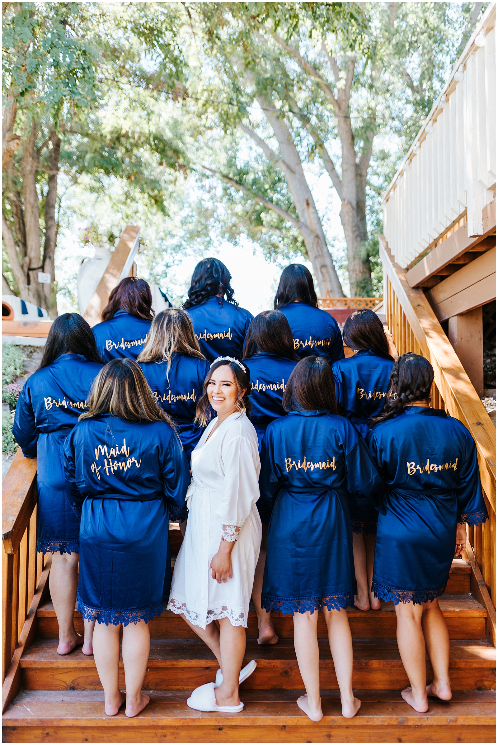 Bridesmaid robes and the Bride getting ready at Dusty Blue Fox Canyon Vineyards Wedding