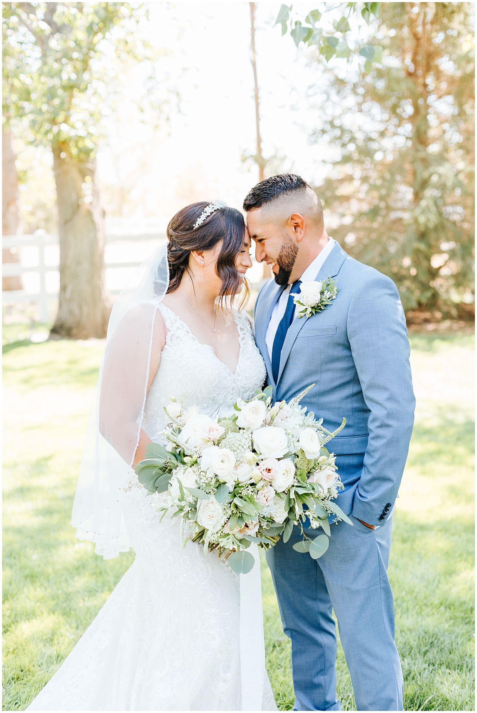 Bride and Groom Wedding Day Portraits with White Bridal Bouquet and Grey Navy Suit at Dusty Blue Fox Canyon Vineyards Wedding