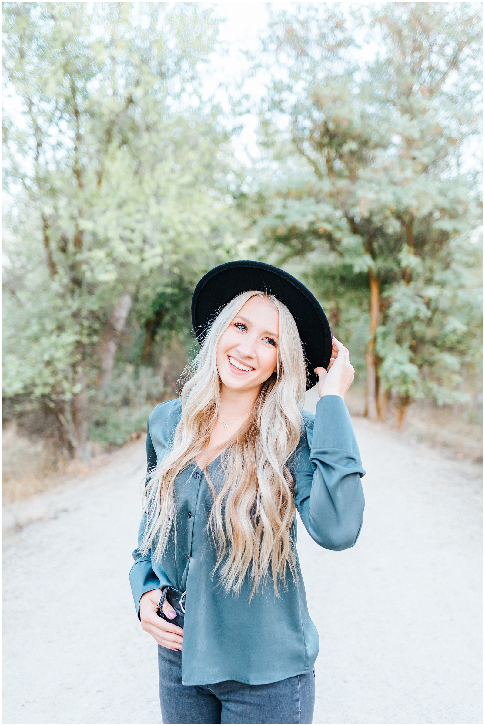 Dreamy Senior Session by the Boise River with trendy black hat