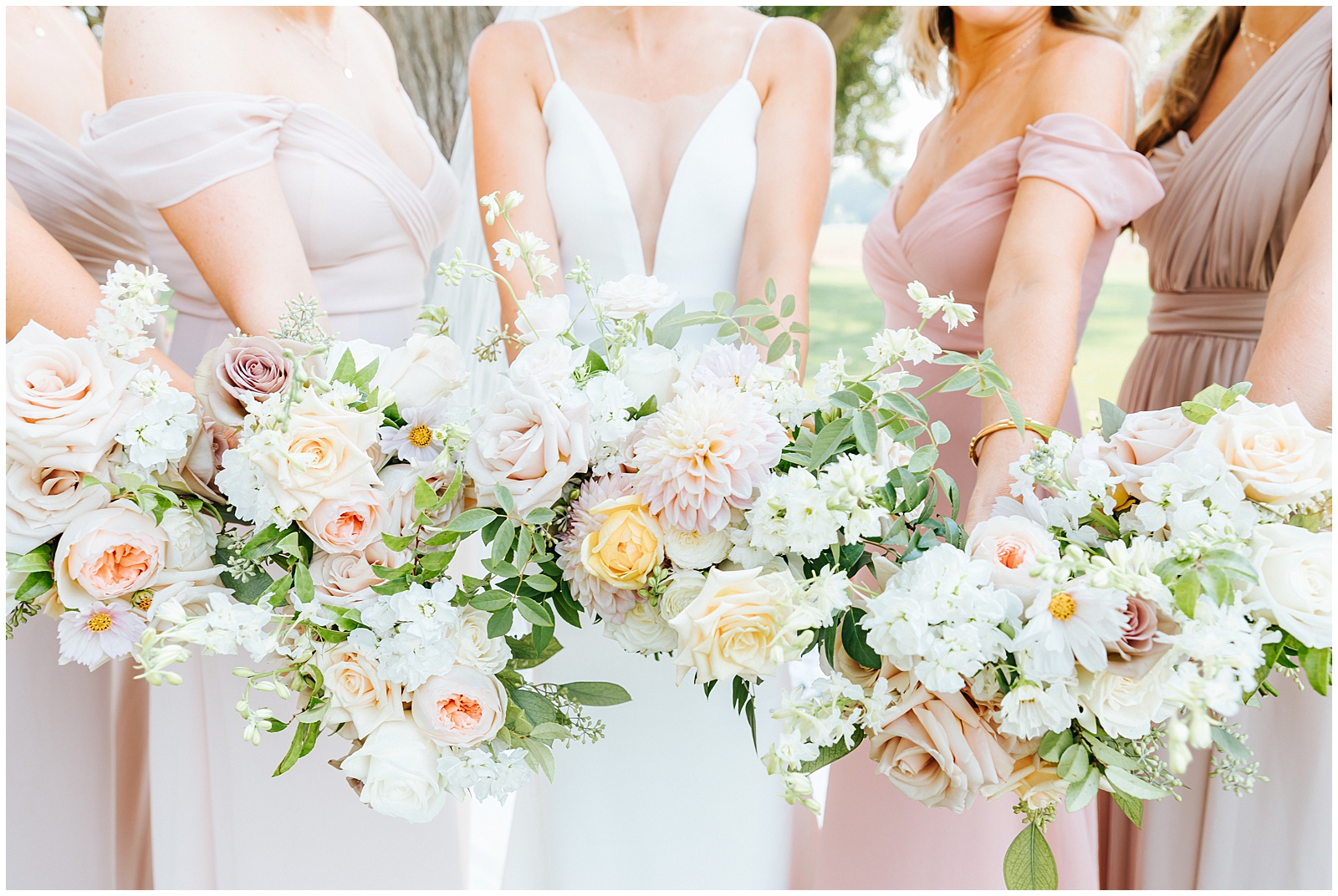 Bridesmaids and Bride's Bouquets with shades of Pinks and Yellows