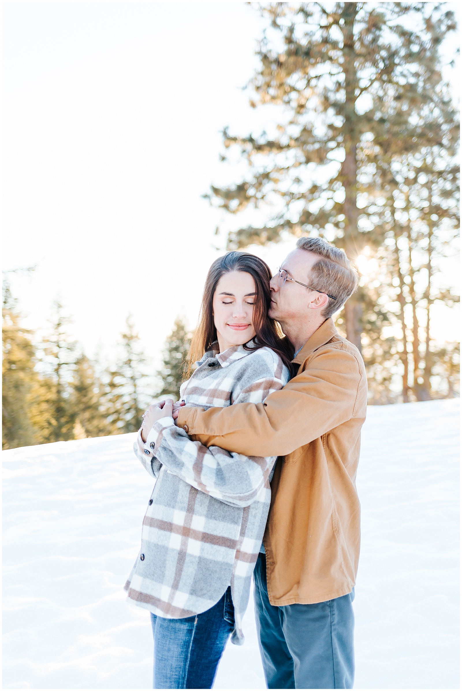 Winter Mountain Engagement Session in the Snow couple in flannels by Karli and David Photography 