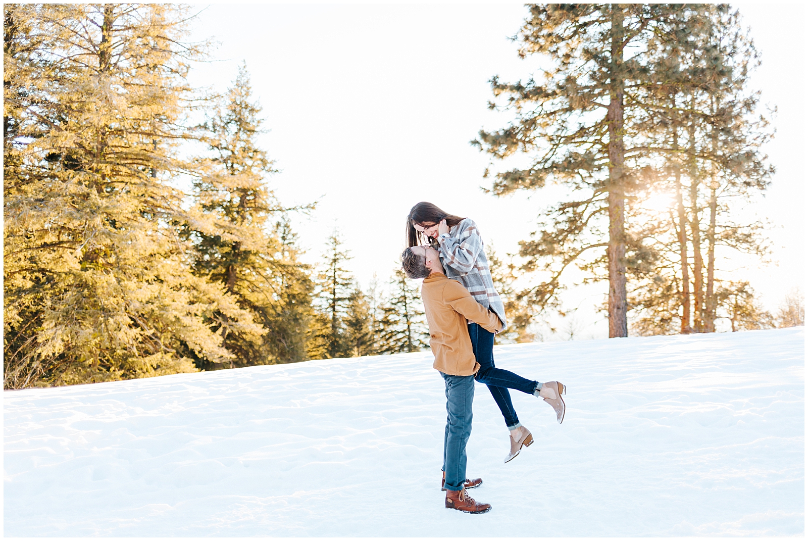 Winter Mountain Engagement Session in the Snow Lifting by Karli and David Photography 