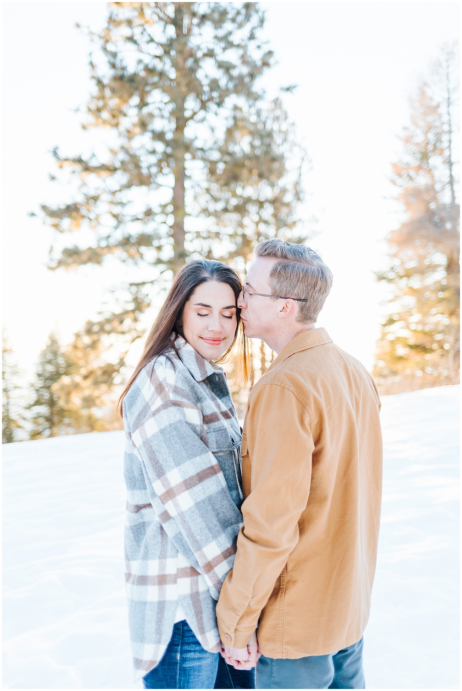 Winter Mountain Engagement Session in the Snow couple in flannels by Karli and David Photography 