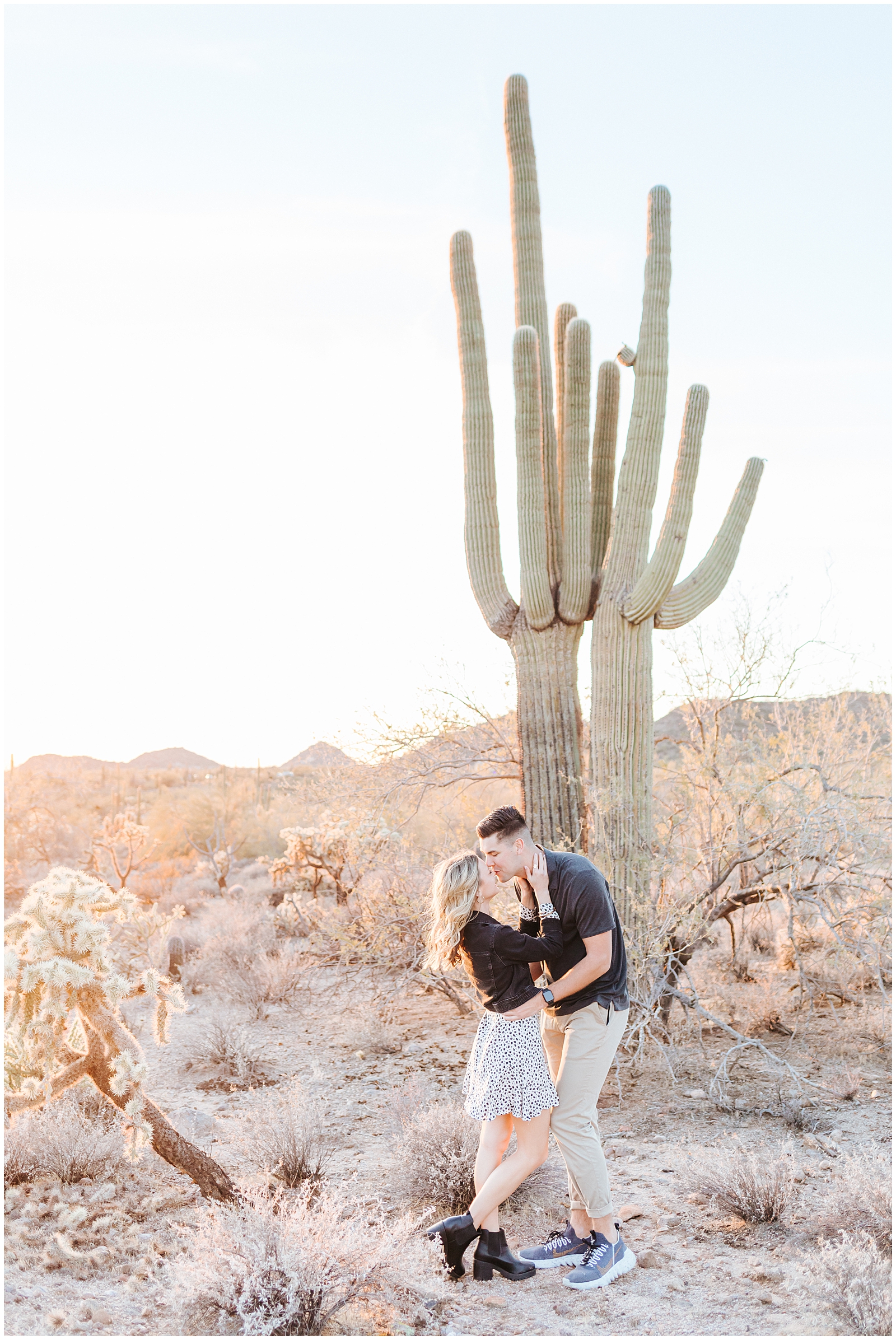 Couple with Cacti in Arizona Desert