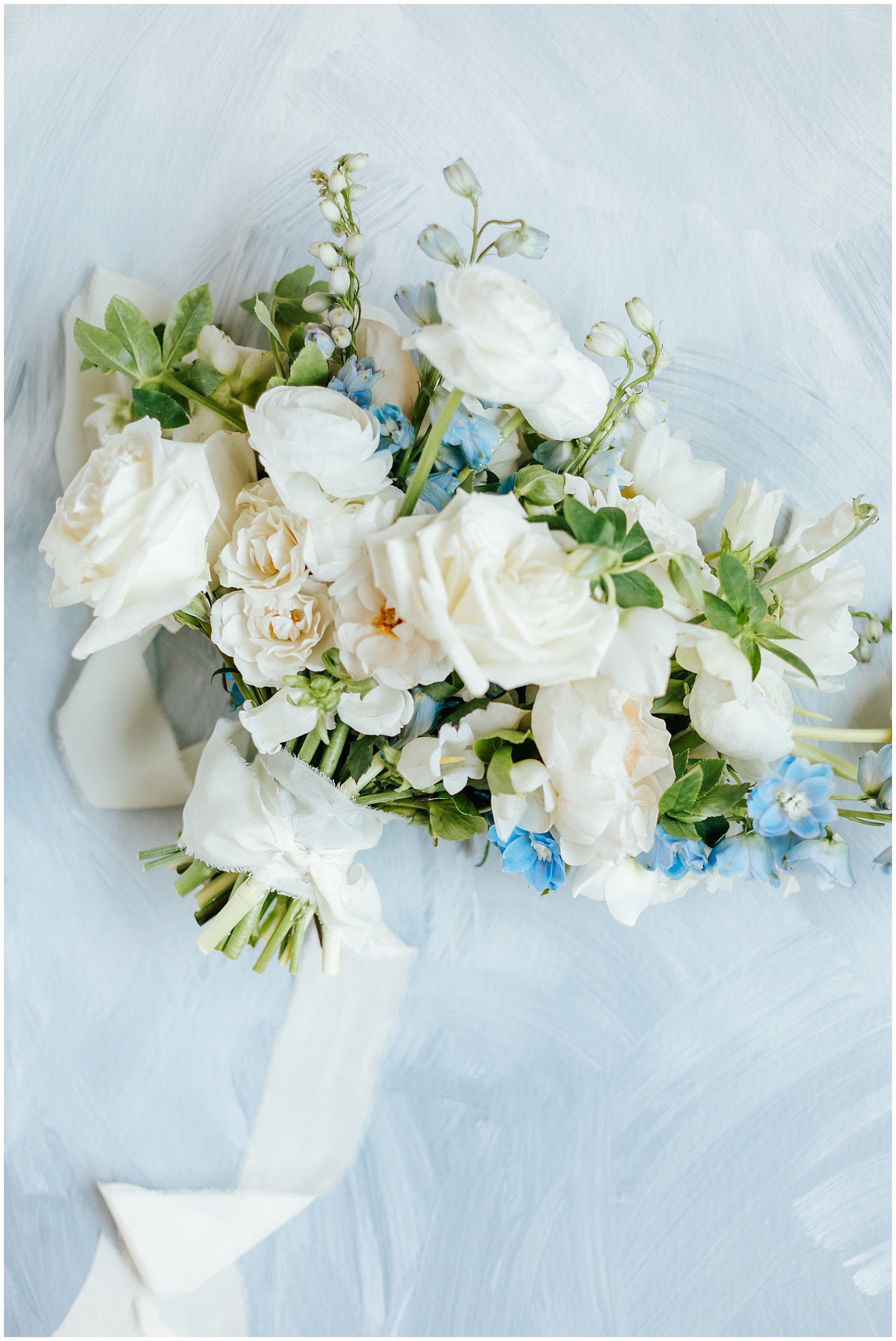 Bridal Bouquet White roses with greenery and blue accents at Classic Elegant Florida Wedding