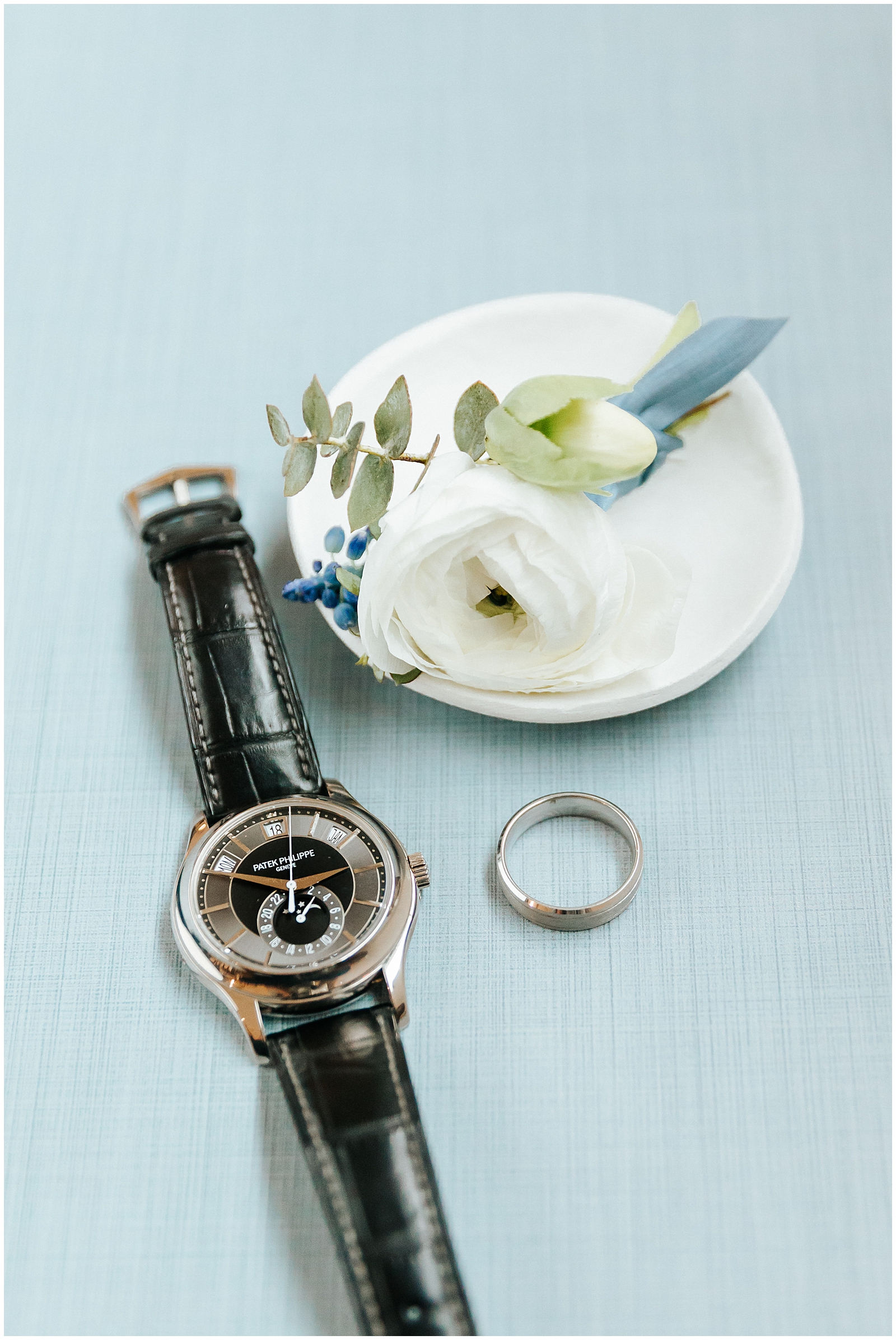 The Groom's Details - Patek Philippe Watch, wedding band, and white Boutonniere 