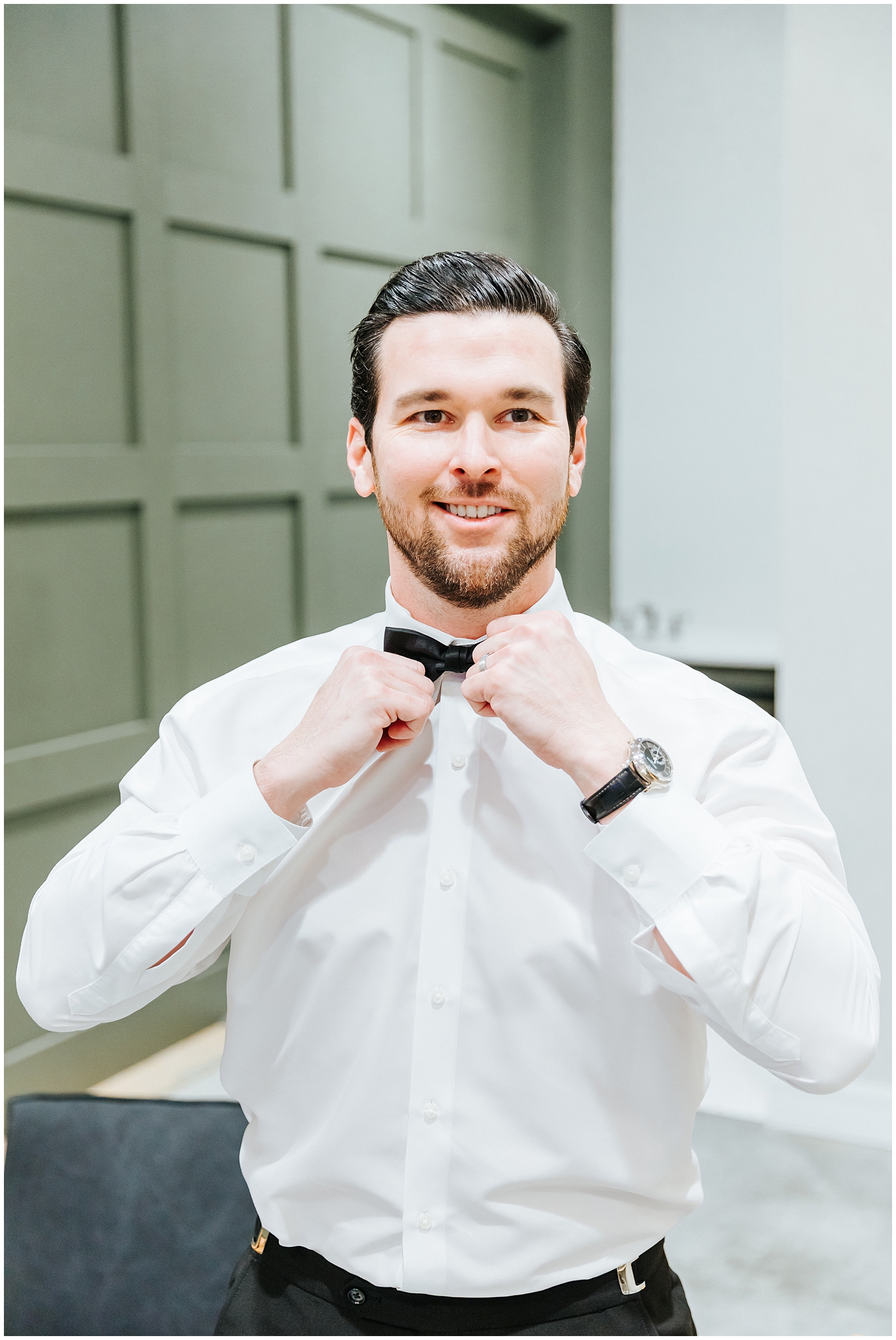 Groom Straightening his Bow Tie at Classic Florida Wedding