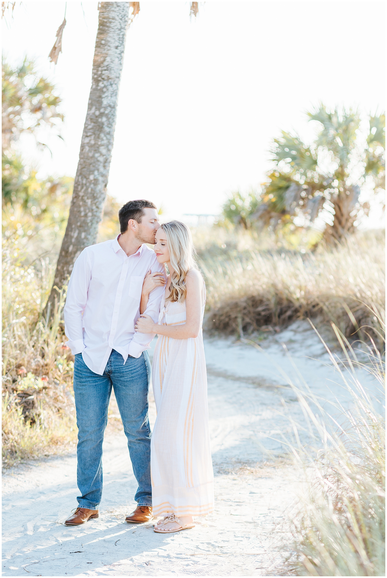 Fort Desoto Florida Couples Session on the Beach with Palm trees and beach grass