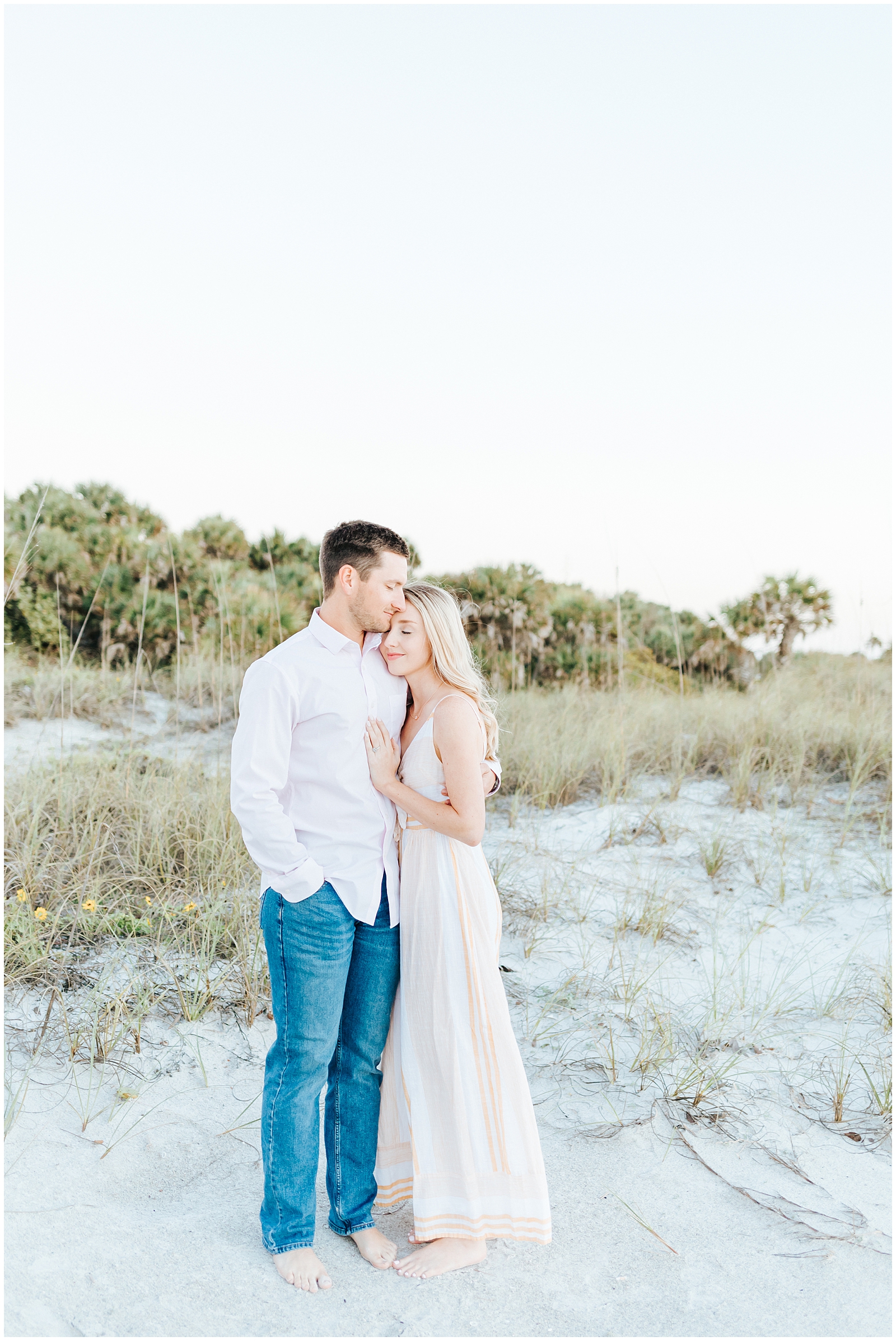 Fort Desoto Couples Session on the beach with Palm Trees at golden hour in Central Florida