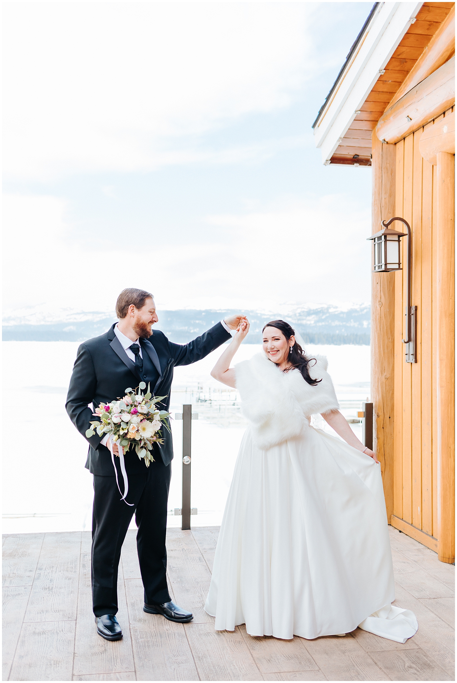 Bride Twirling in front of Frozen Lake payette at Shore Lodge Winter Wedding