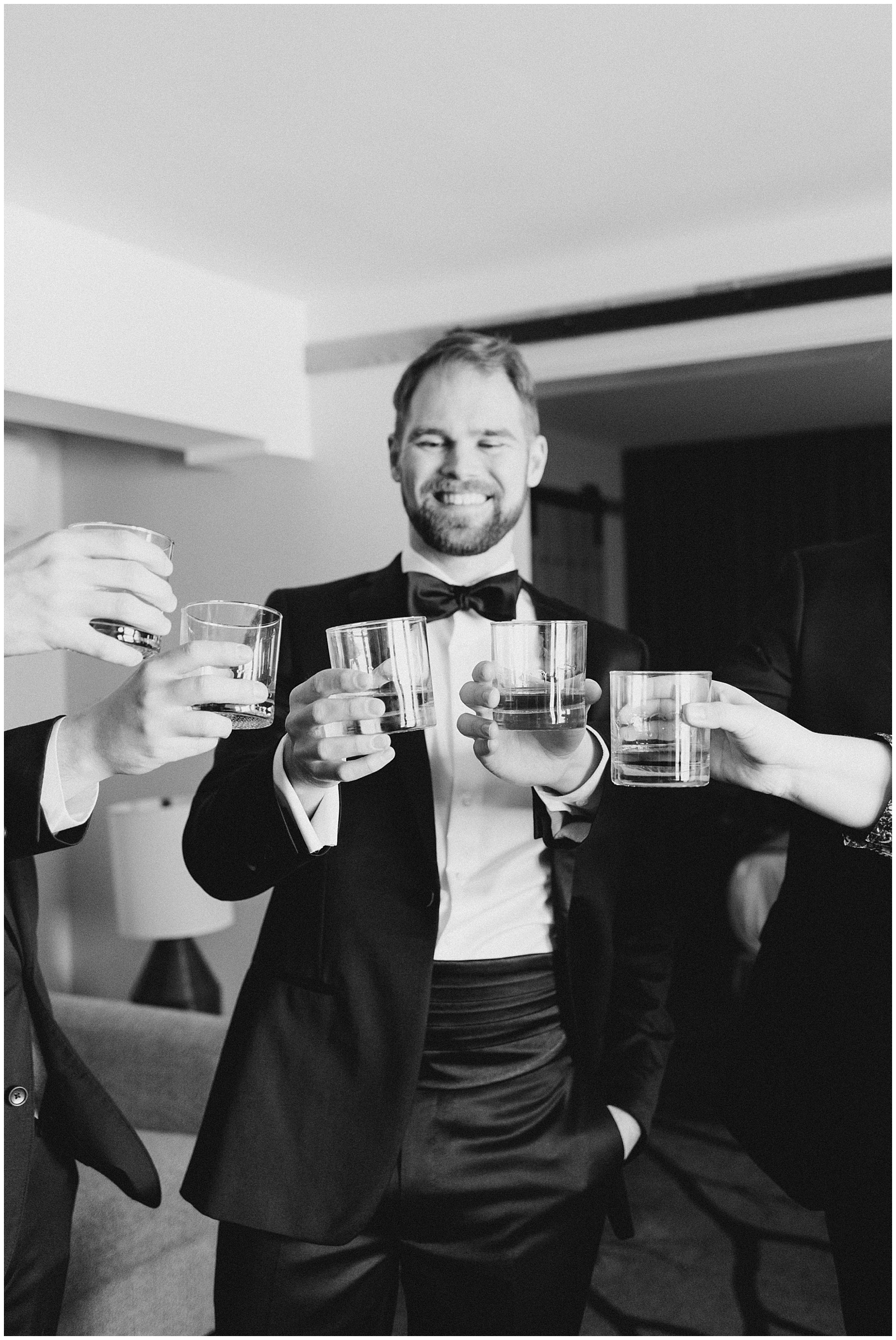 Groomsmen toasting at Winter Shore Lodge Wedding